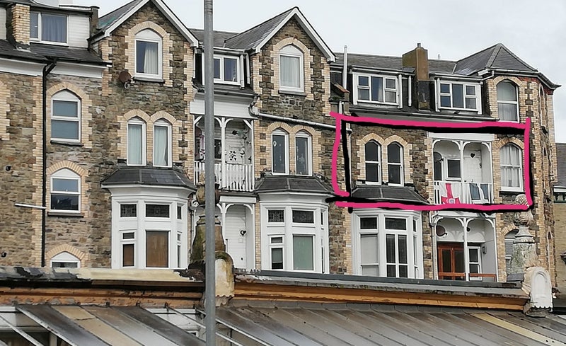 Photo 1: Back of property and balcony 