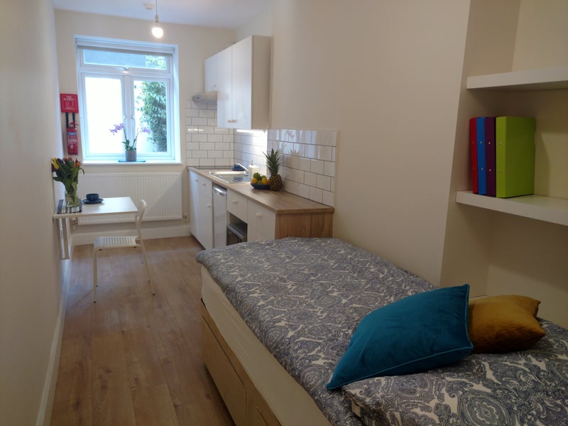 Photo 1: modern and functional studio room in a building with great community