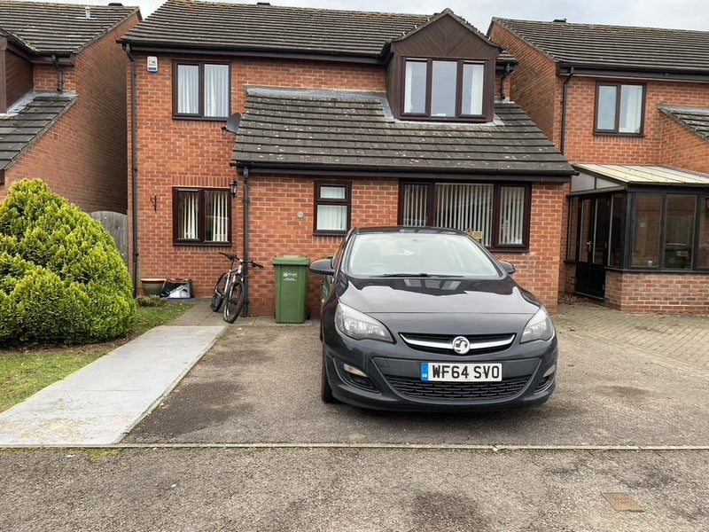 Photo 1: House front with parking