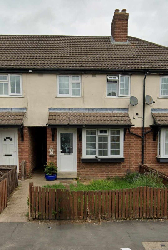 Photo 1: Front of house, secure small front garden with lavender and rosemary bush 