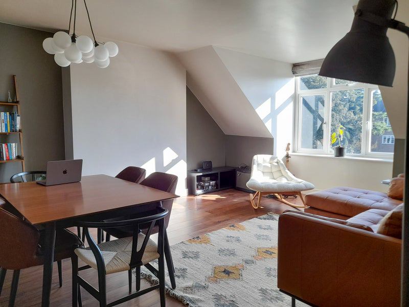 Photo 1: The living room is bright and roomy