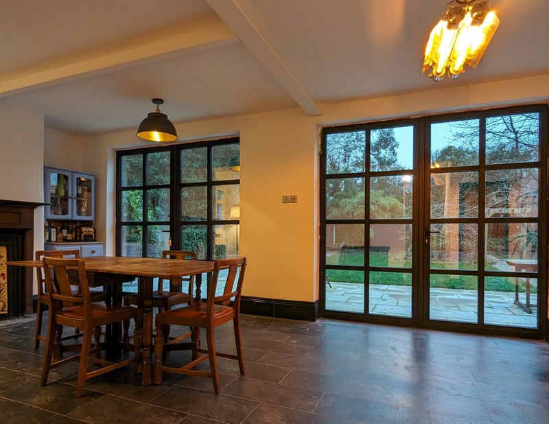 Photo 1: Back room (dining and lounging) with views out to the back garden