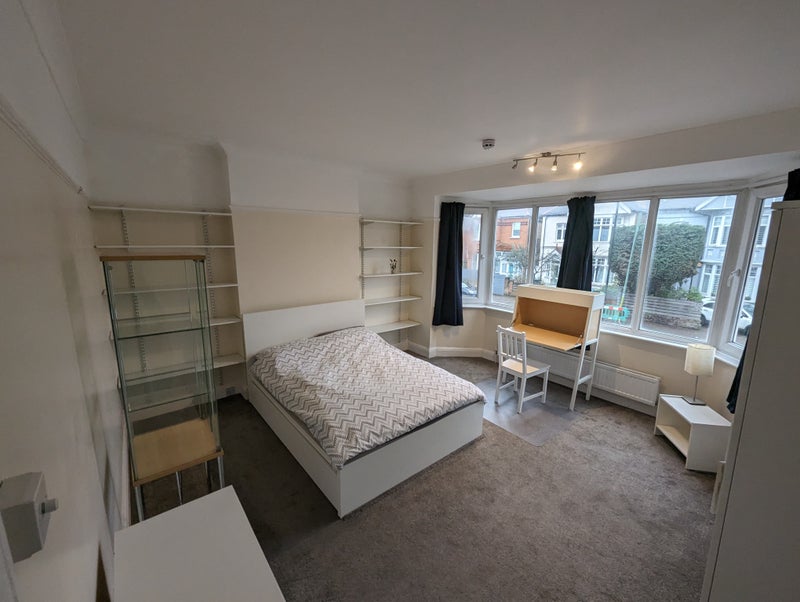 Photo 1: The room is bright and airy with double bed which has storage below