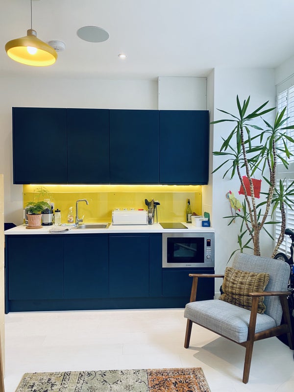 Photo 1: Kitchen with small fridge/freezer, dishwasher, hob and oven/microwave
