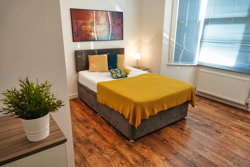 Photo 1: spacious double bed with extra storage underneath