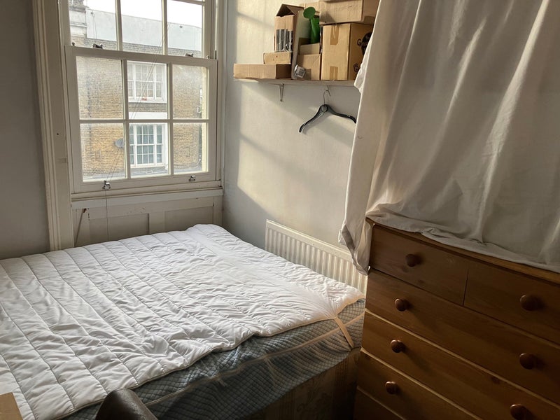 Photo 1: Room 1 - the photo is from when our old flatmate moved out so the sheet is just covering his stuff! 