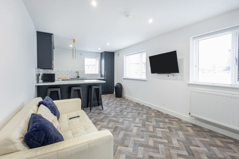 Photo 1: (26B) A spacious living area - to chill or binge on Netflix