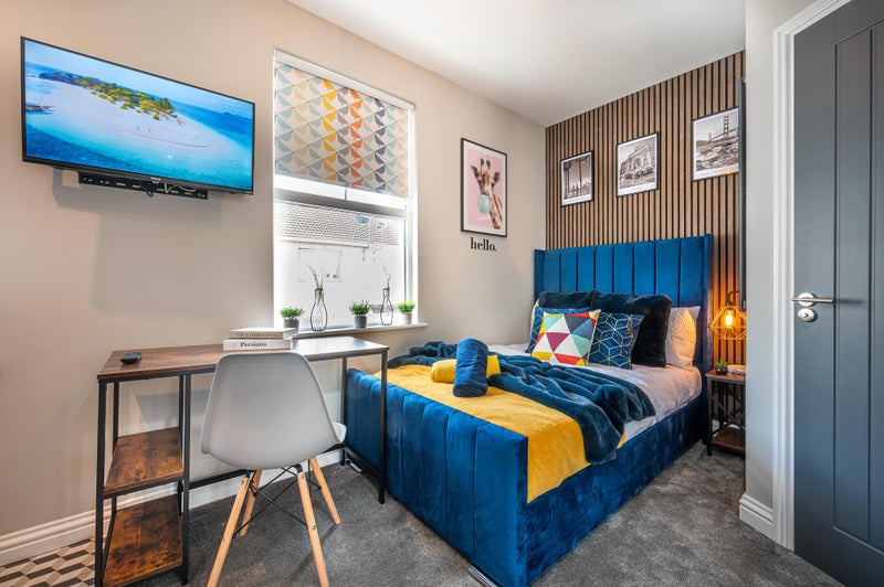 Photo 1: Bed & Desk