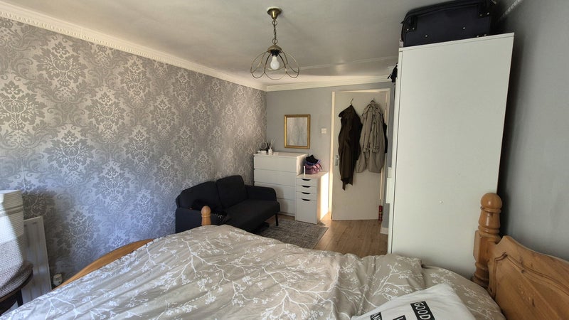 Photo 1: Sofa, rug and small white drawers previous Lodger's