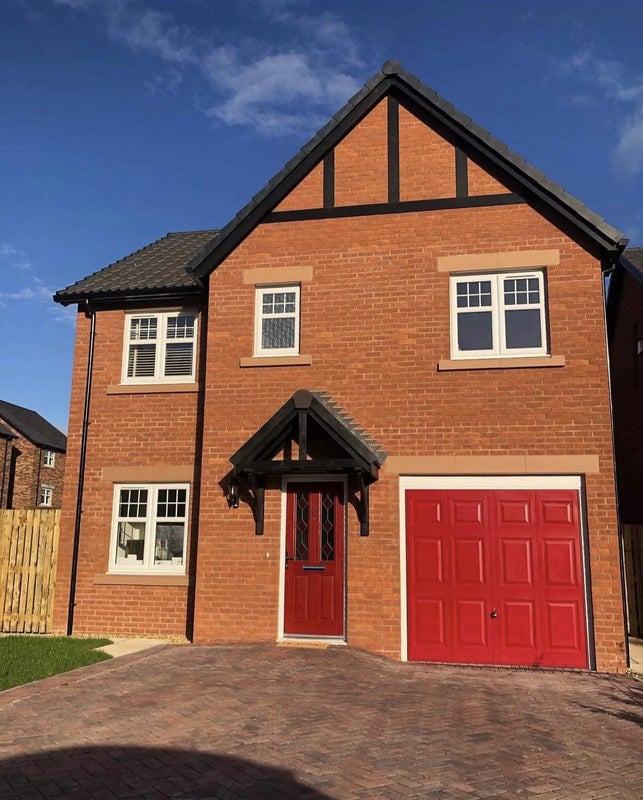 Photo 1: Front of house and parking 