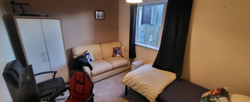 Photo 1: Large room with seating 