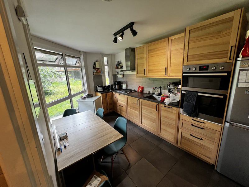Photo 1: Kitchen-dining area