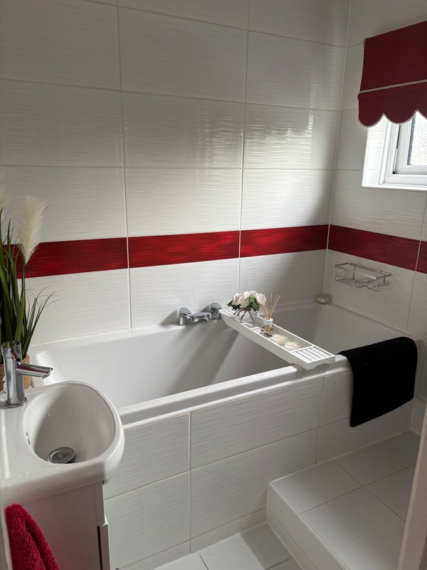 Photo 1: A shower is also available in this room with a bath. 