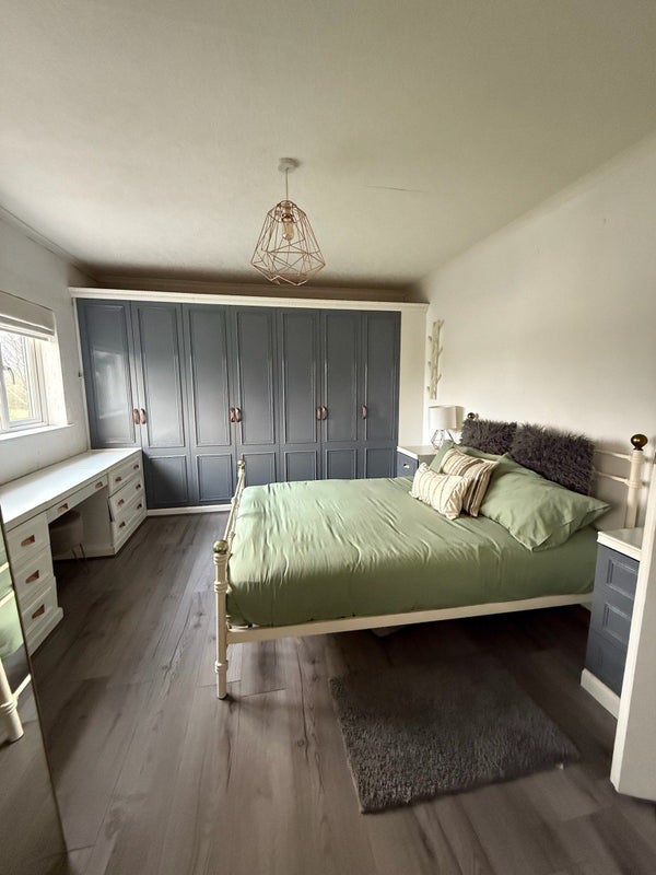 Photo 1: Room 1: Large Bed Room includes a large closet & a lot of storage space.