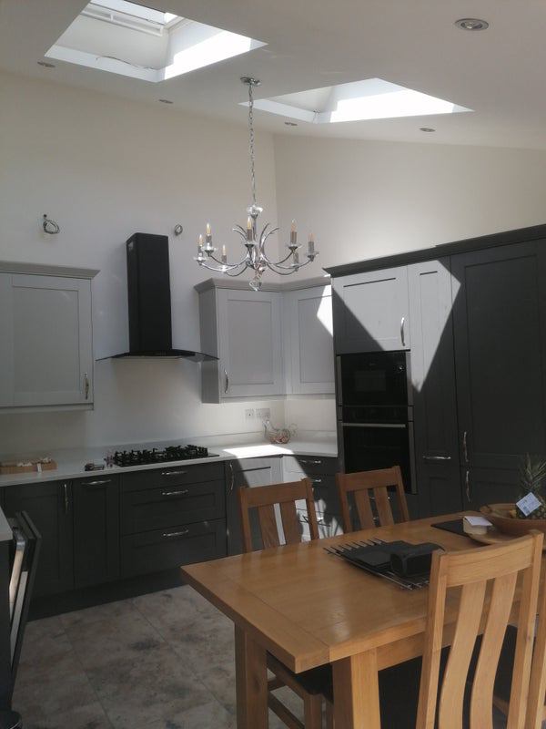 Photo 1: Kitchen and dining area with bi-fold doors to the garden
