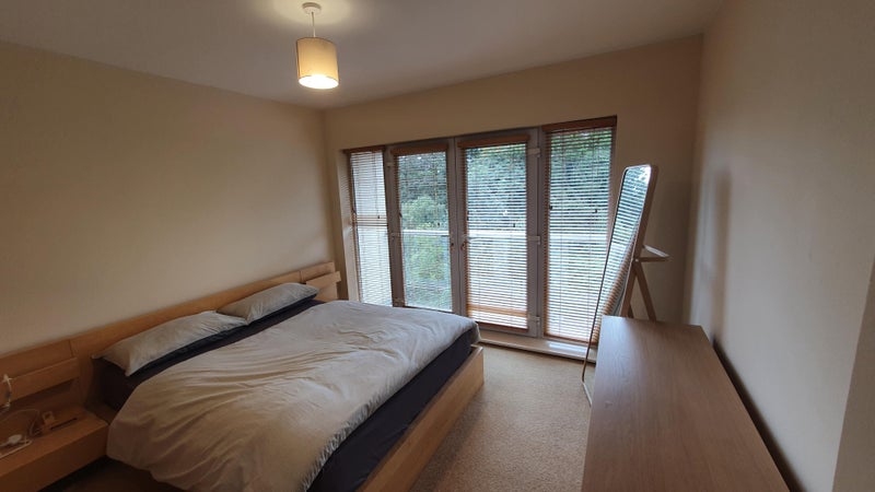 Photo 1: Luxurious Double En-Suite room with double bed, mirror, desk and chest of drawers