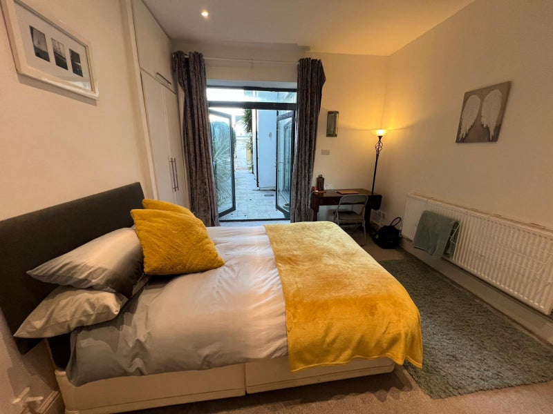 Photo 1: Ground floor room with French doors