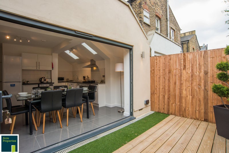 Photo 1: Open plan kitchen, dining + Garden