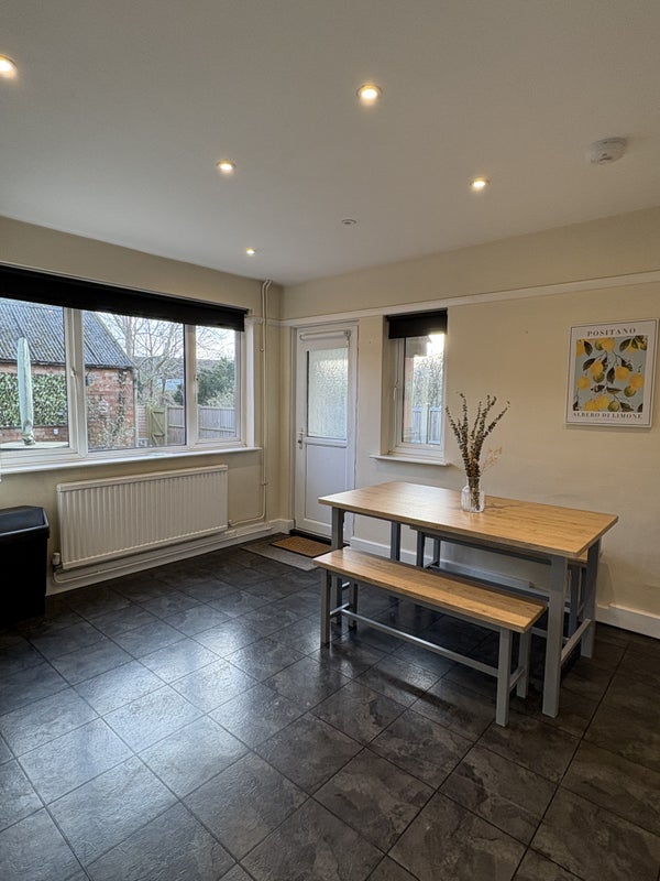 Photo 1: Shared kitchen dining area