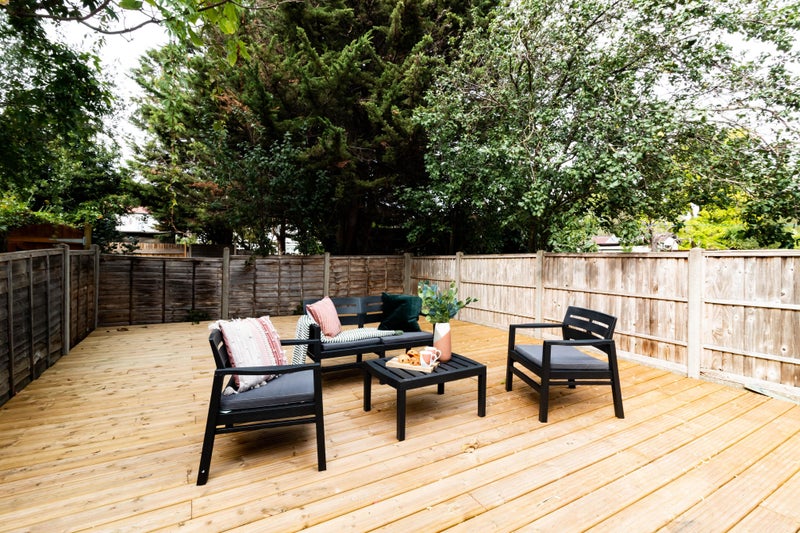 Photo 1: Back deck garden