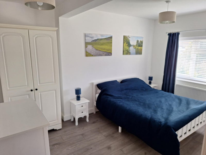 Photo 1: Large king-sized bed and furniture