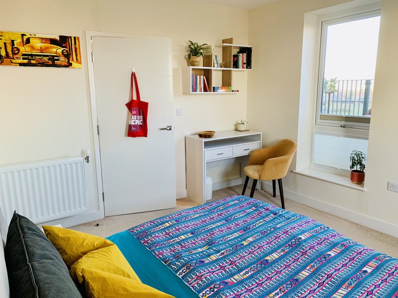 Photo 1: Bedroom with pull out desk