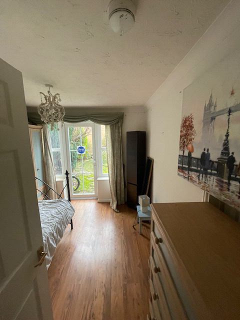 Photo 1: Nice size room with chest of drawers and wardrobe to the left of the picture