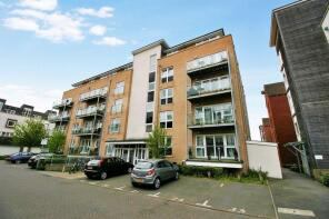 Photo 1: Front of block of flats