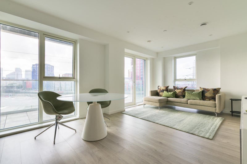 Photo 1: Living Room with Balcony