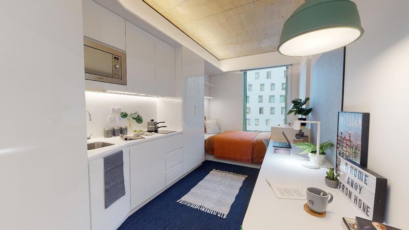 Photo 1: Wide-angle view of room from near door