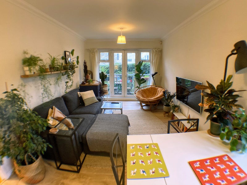 Photo 1: Living Room and Balcony