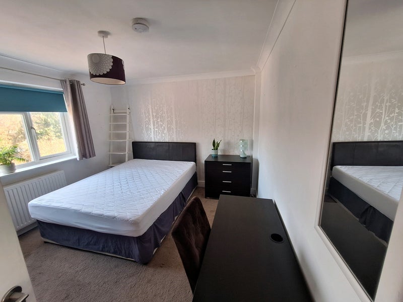 Photo 1: Bedroom with king size bed and garden view