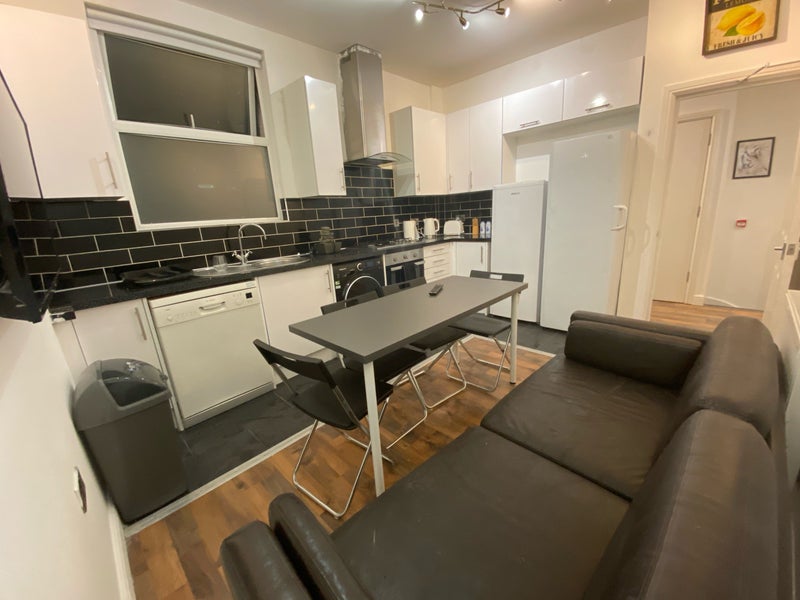 Photo 3: Living eoom with open olan kitchen 