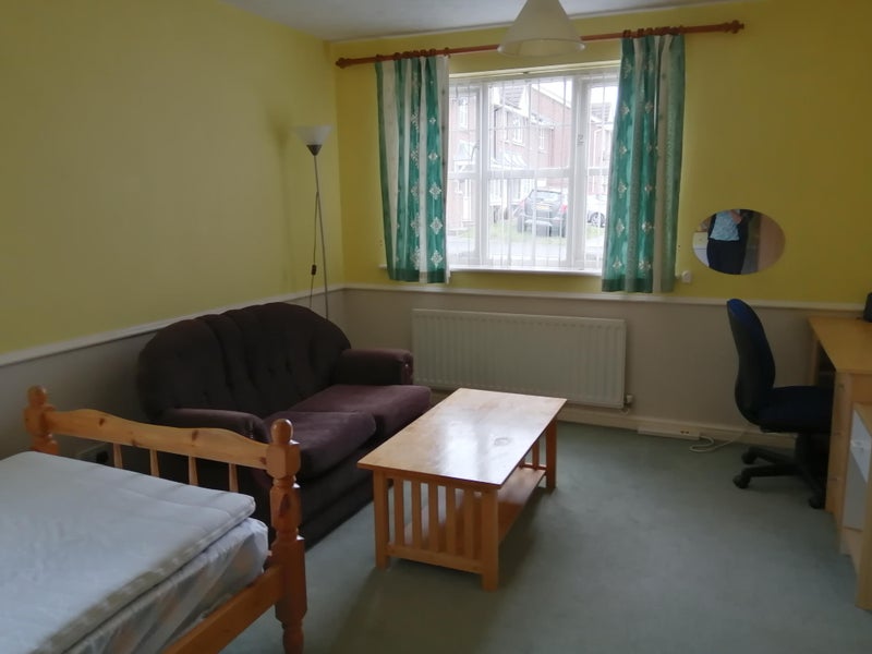 Photo 6: Bedroom 2 with sofa and coffee table