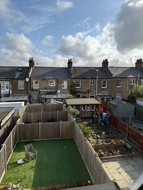 Photo 1: Garden and living room view