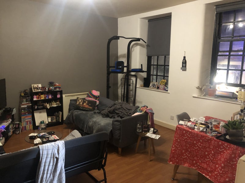 Photo 1: The current living room, the space has a lot of potential.