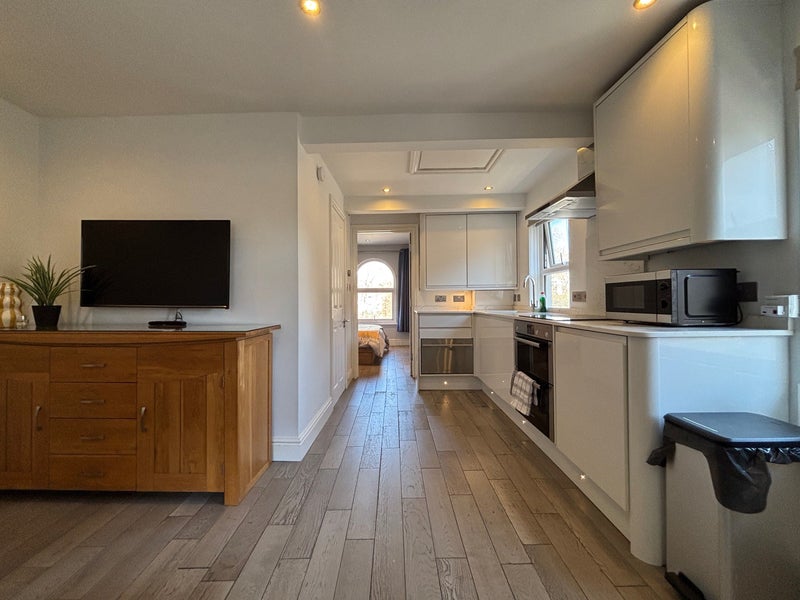 Photo 1: Kitchen area