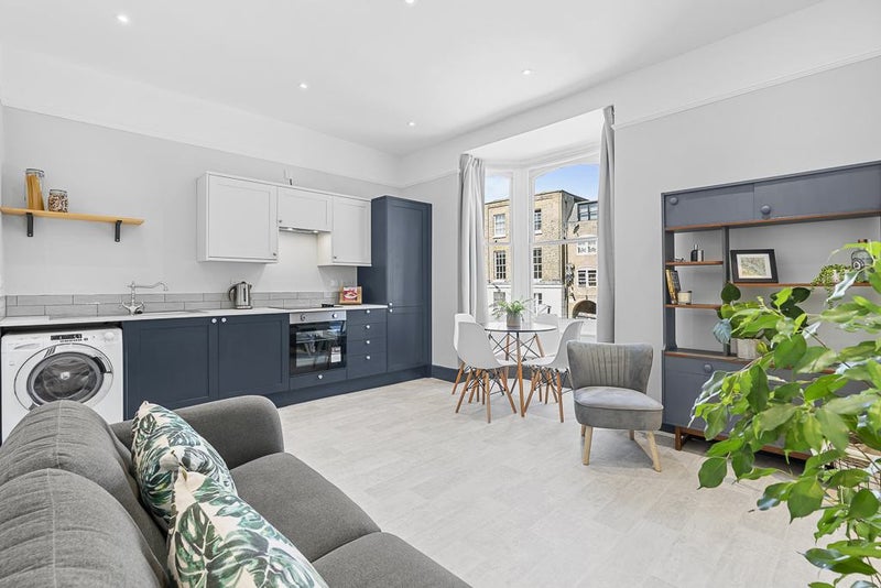 Photo 1: Bay windows and natural light