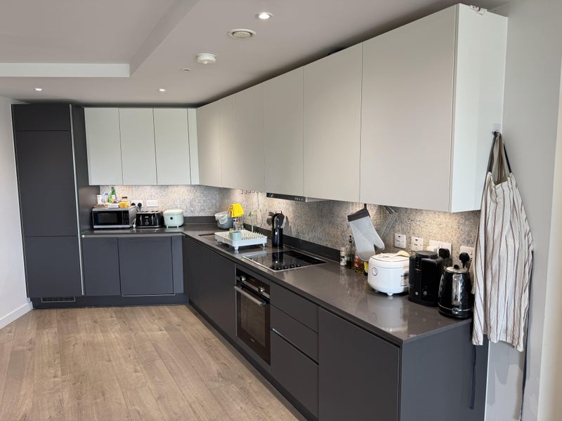 Photo 6: The kitchen set-up, with large amounts of counter space and storage