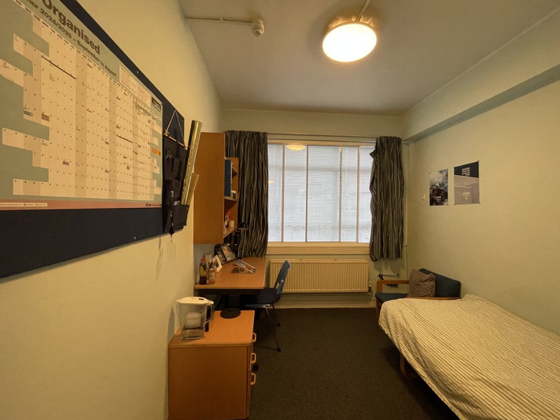 Photo 1: Bed and desk