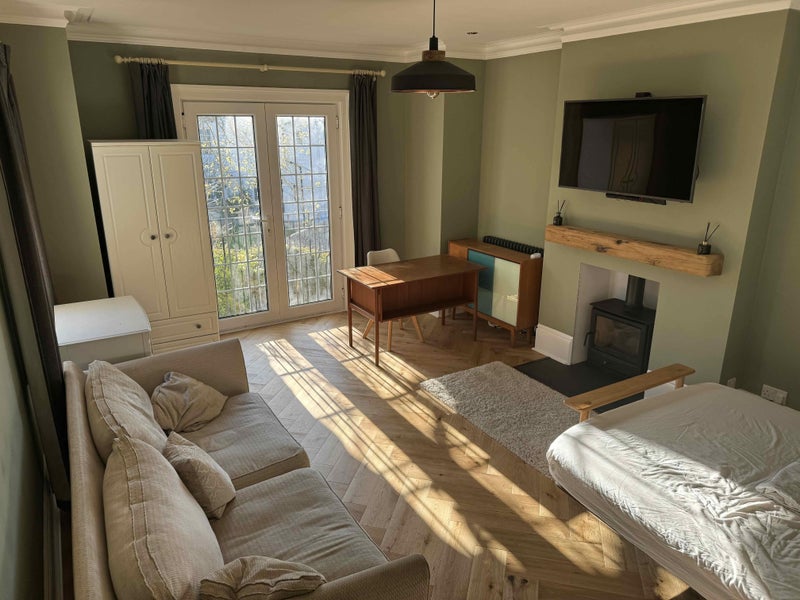 Photo 1: Double-door Juliet balcony lets in evening light