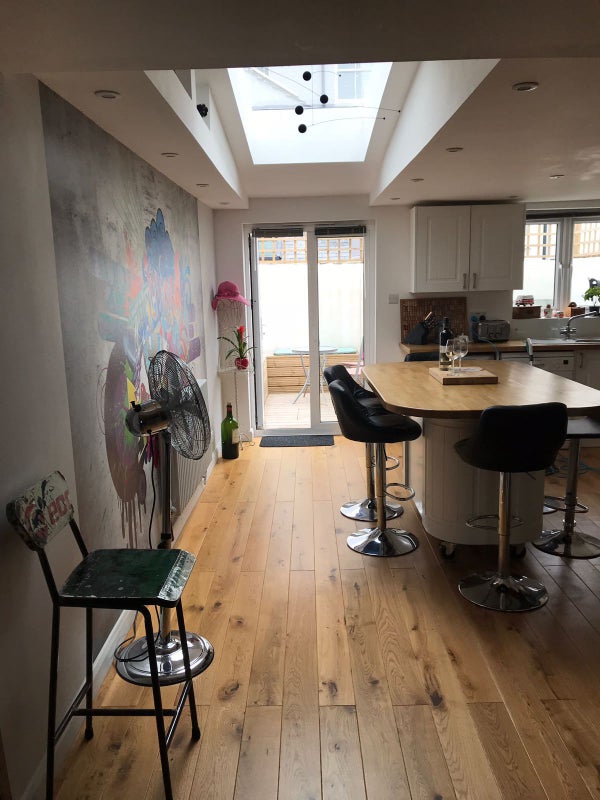 Photo 1: Modern funky decor in kitchen with huge central island