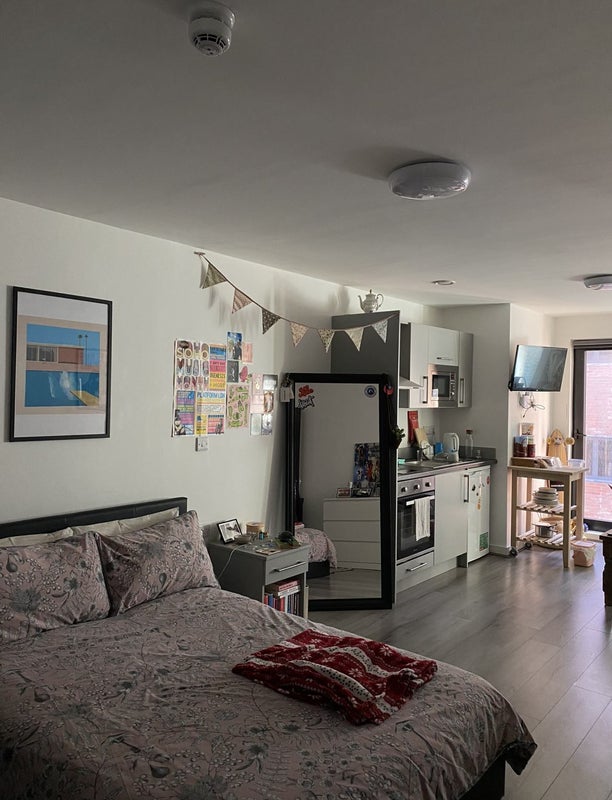 Photo 1: Studio (storage beneath bed)