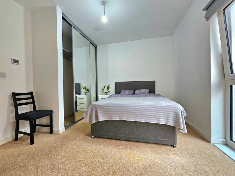 Photo 1: Spacious bedroom with plenty of storage