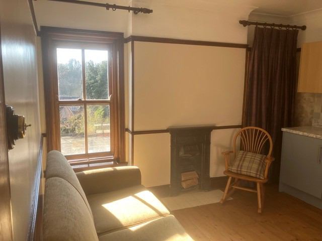 Photo 1: Living room/kitchen (south facing)