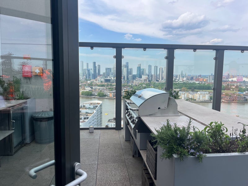 Photo 1: Building roof terrace with communal bbqs