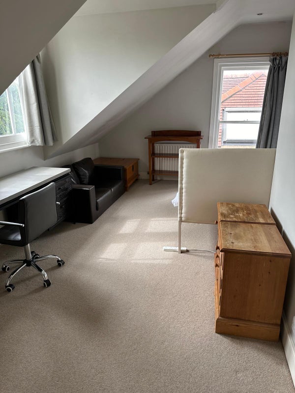 Photo 1: Bedroom with desk and double bed