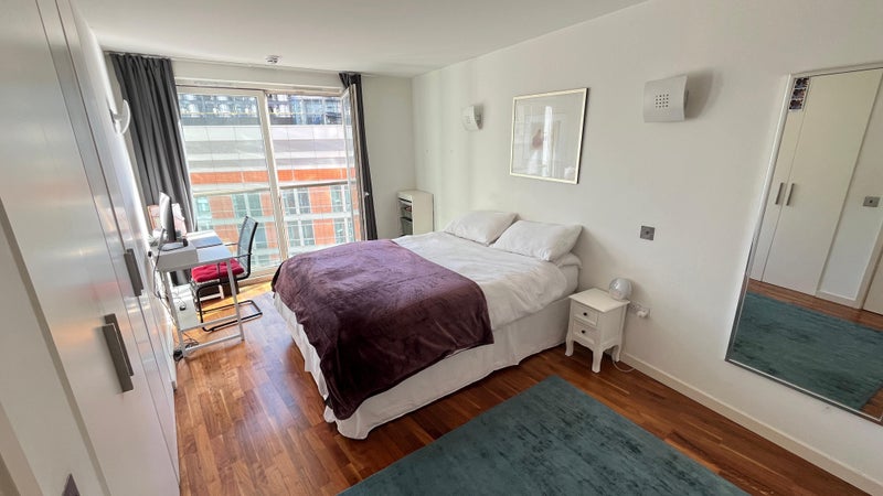 Photo 1: Large bedroom with lots of built in storage. Desk can be included upon request