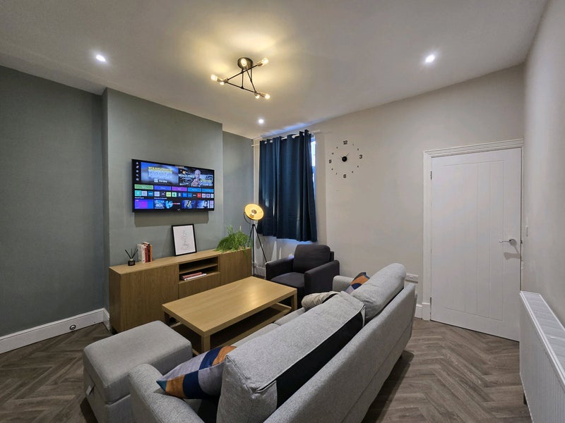 Photo 1: Big communal living room with Digital TV
