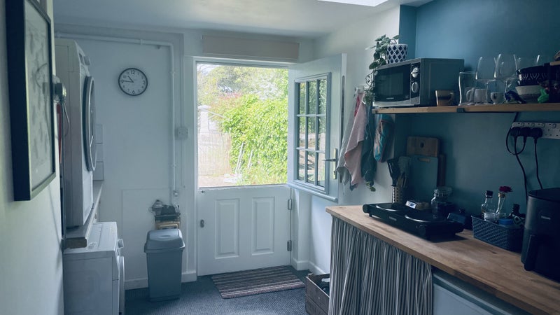 Photo 1: Front door into kitchenette 